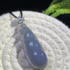 18K blue jadeite bean pendant with smooth lavender-blue gemstone set in gold