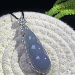 18K blue jadeite bean pendant with smooth lavender-blue gemstone set in gold
