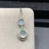 Elegant 18K gold jade necklaces with ice-clear oval pendants showcasing natural jade stones