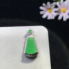 Close-up of full green jadeite Ruyi plaque on 18K gold pendant