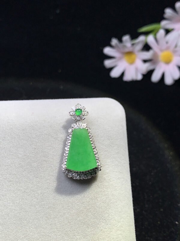 Close-up of full green jadeite Ruyi plaque on 18K gold pendant