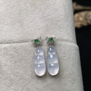 Front view of 18K gold high-ice drop jade earrings with seeded bean-shaped jade stones