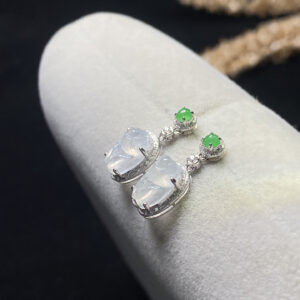 Front view of 18K high ice jade stone earrings featuring delicate cicada design and translucent jade