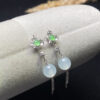 Front view of 18K high ice jade trau earrings showing radiant translucent jade beads