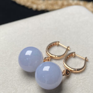 Front view of 18K ice purple jade earrings showcasing smooth translucent purple jade beads