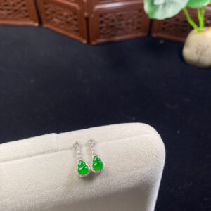 Front view of 18K imperial jade earrings featuring carved gourd-shaped jade stones