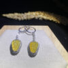 Front view of 18K lemon yellow leaf yellow jade earrings showcasing vibrant leaf-shaped jade stones