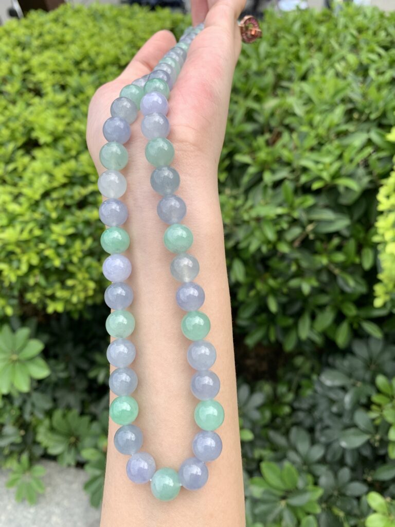 Display of authentic jade bead necklaces in a boutique