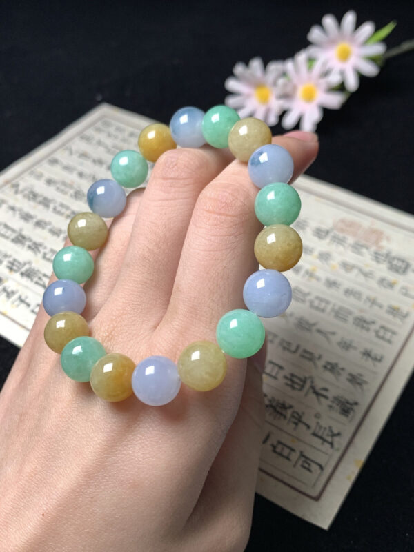 Beaded jade bracelet with 10mm yellow, purple, and green jade beads