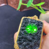 Front view of 18K gold black jade dragon pendant