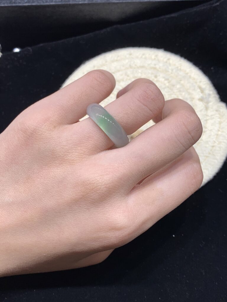 A jade ring placed on ancient Chinese calligraphy scroll