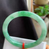 Front view of genuine jade bangle bracelet with vivid icy green color