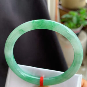 Front view of genuine jade bangle bracelet with vivid icy green color