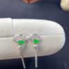 Front view of 18K green jade and gold fan earrings showcasing elegant carved jade and polished gold design