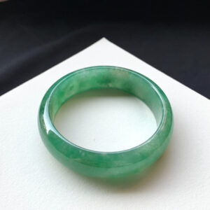 Front view of full-green icy green jade bracelets measuring 57.6mm