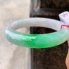 Front view of green jade stone bracelet with icy green tone