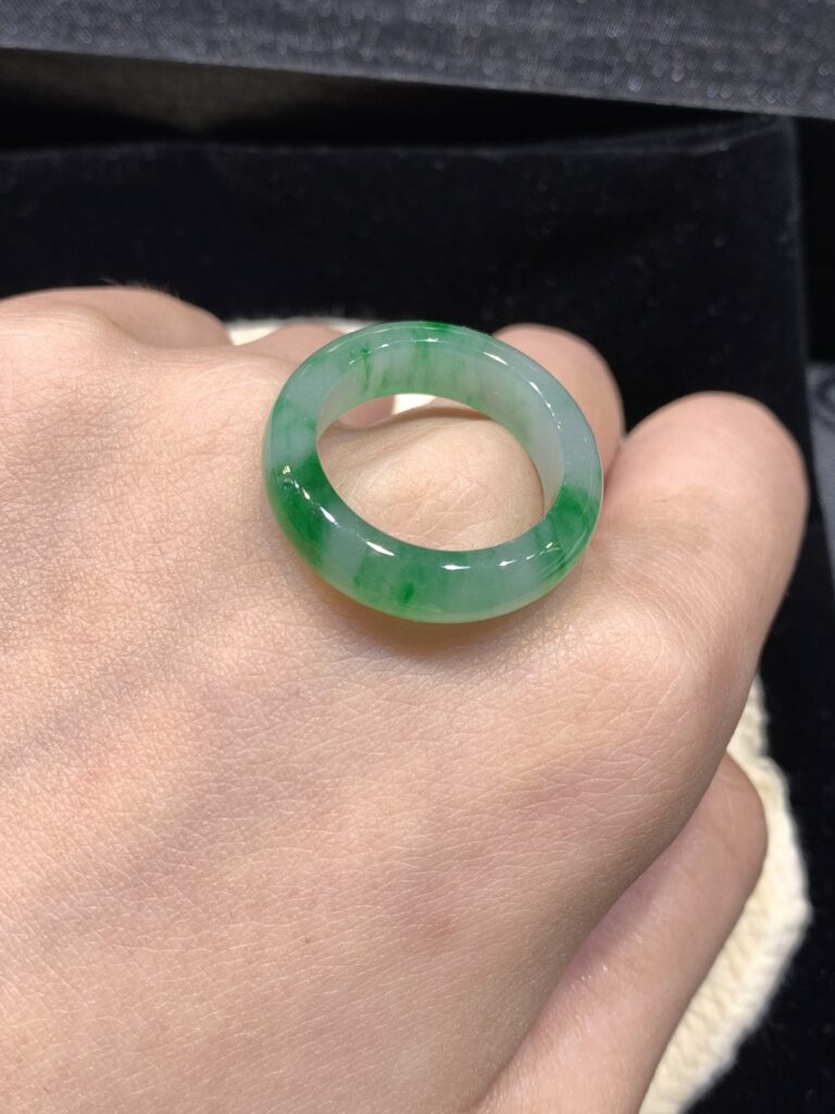 Close-up of a high-quality imperial green jade ring in gold setting