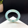 Right angle view of 56.7mm jade bangle bracelet with translucent finish