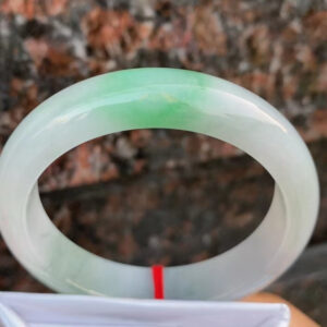 Front view of icy green jade bangle bracelet