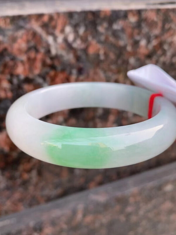 Side view showing the 13mm thickness of jade bracelet