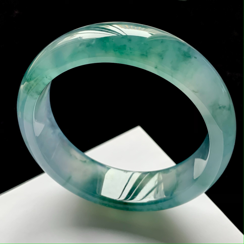 Close-up of jade bracelet symbolizing healing energy