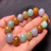 Side view from left of men’s tricolor jade bracelet with natural jadeite