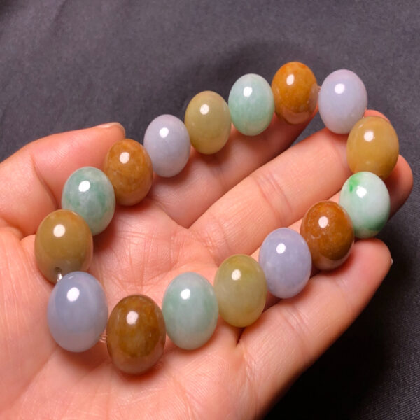 Side view from left of men’s tricolor jade bracelet with natural jadeite