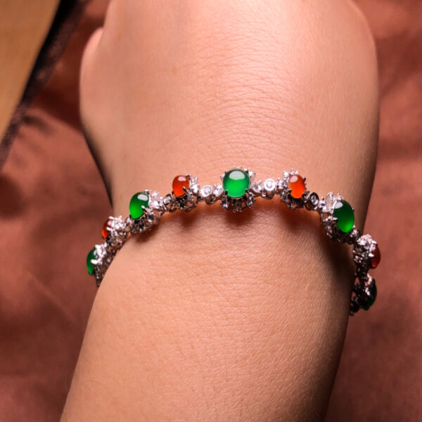 Left side view of 18K gold jade bracelet with colorful jadeite stones