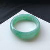 Right angle of real jade bracelets highlighting translucency and color depth