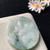 jade buddha statue lotus Guanyin pendant carved from icy green jade with floating patterns