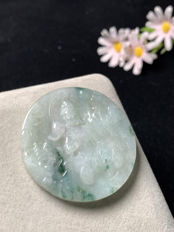 jade buddha statue lotus Guanyin pendant carved from icy green jade with floating patterns
