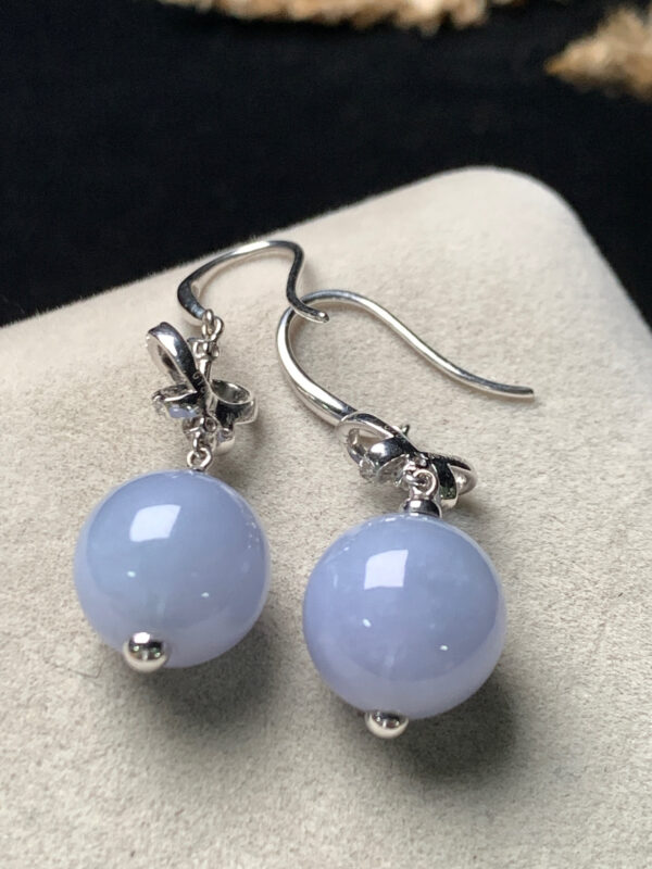 Front view of jade dangle earrings with ice lavender jade beads set in 18K gold