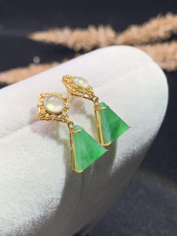 Front view of 18K gold jade drop earrings featuring ice green jadeite stones