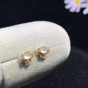 Front view of 18K white ice jade earrings featuring smooth oval jade stones, size 7.2×9.8×4.4mm