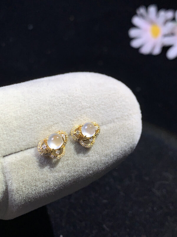 Front view of 18K white ice jade earrings featuring smooth oval jade stones, size 7.2×9.8×4.4mm