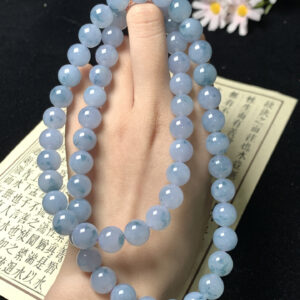 Close-up of 10mm blue-purple floating jade beads necklace for women, showcasing natural floating flower patterns