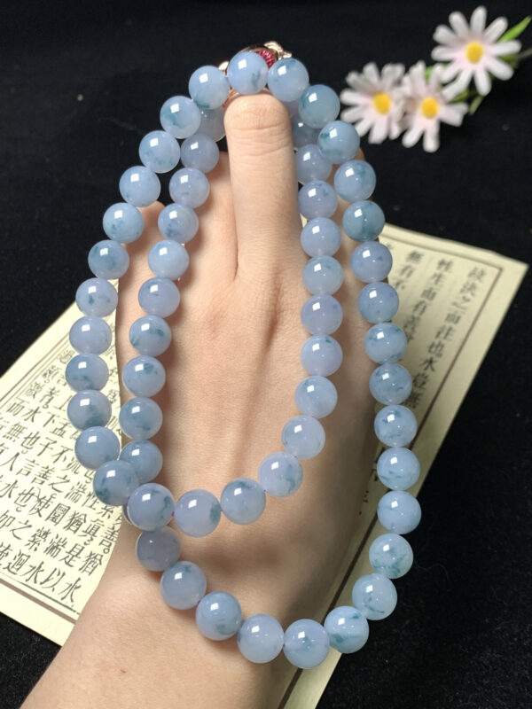 Close-up of 10mm blue-purple floating jade beads necklace for women, showcasing natural floating flower patterns