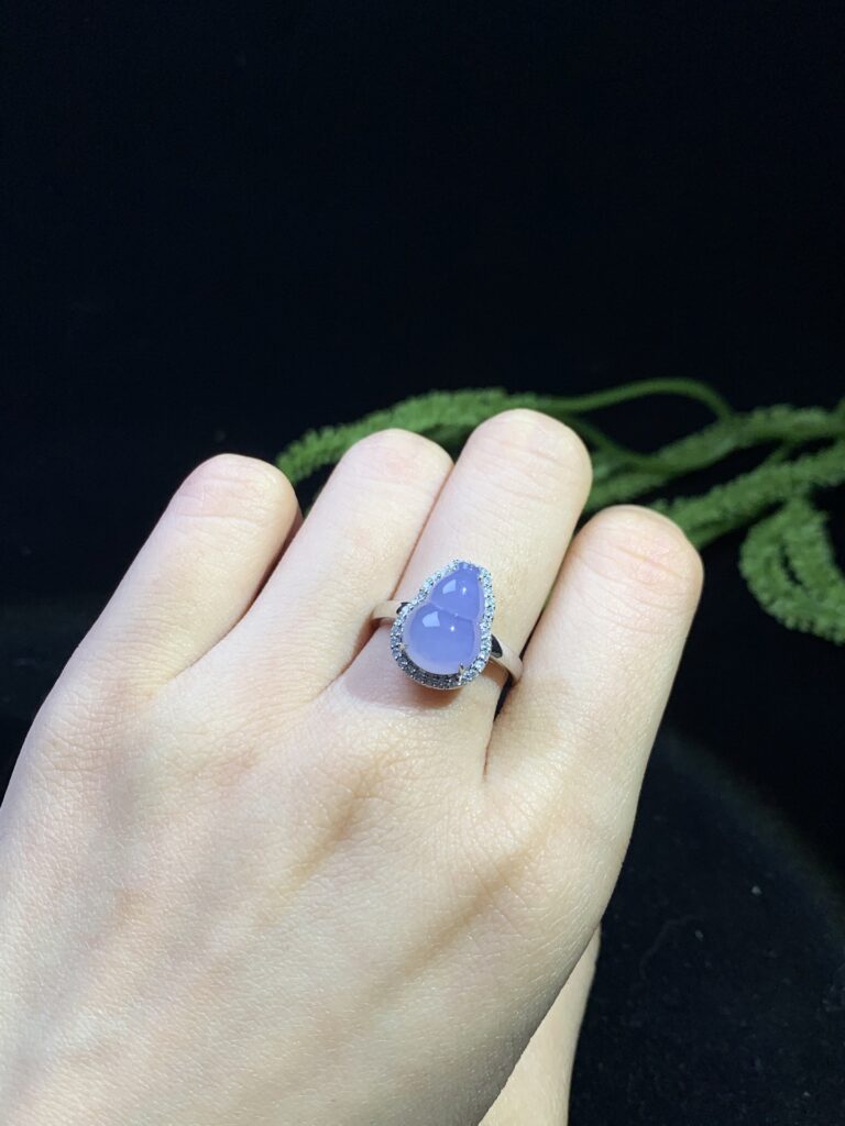 Classic green jade ring jewelry with polished cabochon stone in gold setting