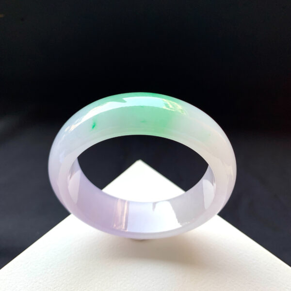 Wide-band jade stone bracelet crafted from high-quality jade, representing strength and protection.