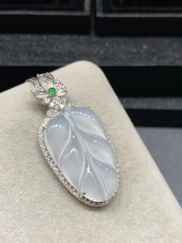 High-ice white jade leaf pendant in 18K gold setting, a stunning jade stone pendant design