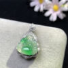 18K jade stone pendant with icy green floating Buddha attached to gold necklace chain