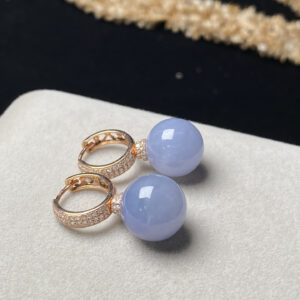 Front view of 18K gold lavender jade earrings featuring 13mm ice-purple jade beads