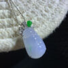 Front view of 18K gold lavender jade pendant featuring icy purple and floating green lucky bean carving