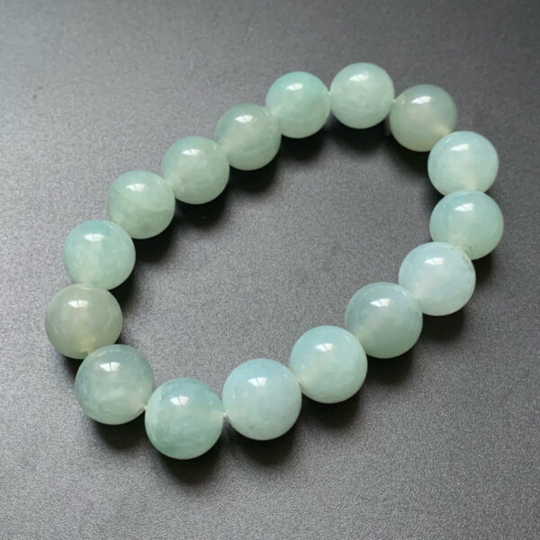 Front view of 12.8mm mens jade bracelet made from icy green jadeite