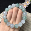 Close-up of blue and green jade beads in real jade jewelry bracelet