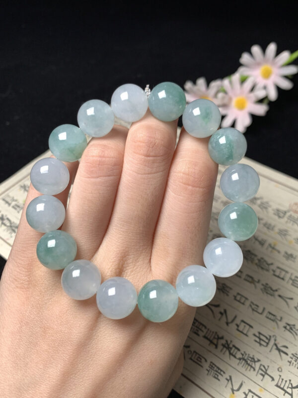 Close-up of blue and green jade beads in real jade jewelry bracelet