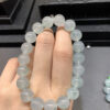 Close-up of real jadeite bracelet with 10mm ice green floating flower beads
