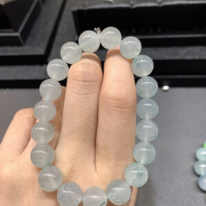 Close-up of real jadeite bracelet with 10mm ice green floating flower beads
