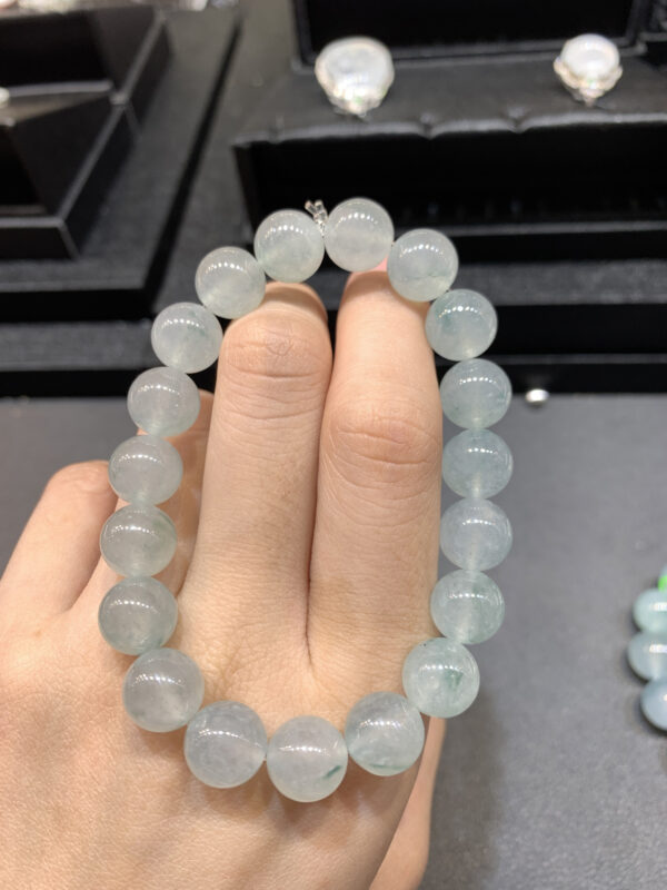 Close-up of real jadeite bracelet with 10mm ice green floating flower beads
