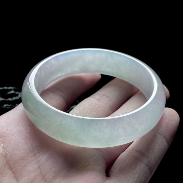 Front view of 57.4mm icy Qing Shui white jade bracelets